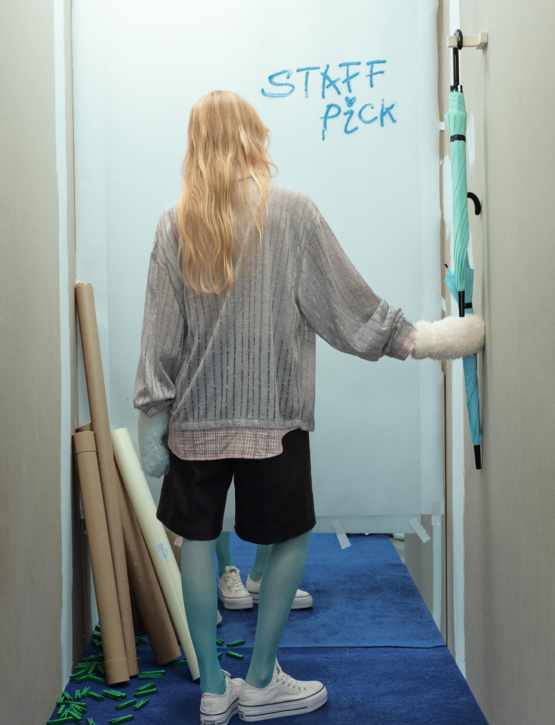 Gray mesh top from back on model, showing plaid hem and sleeves