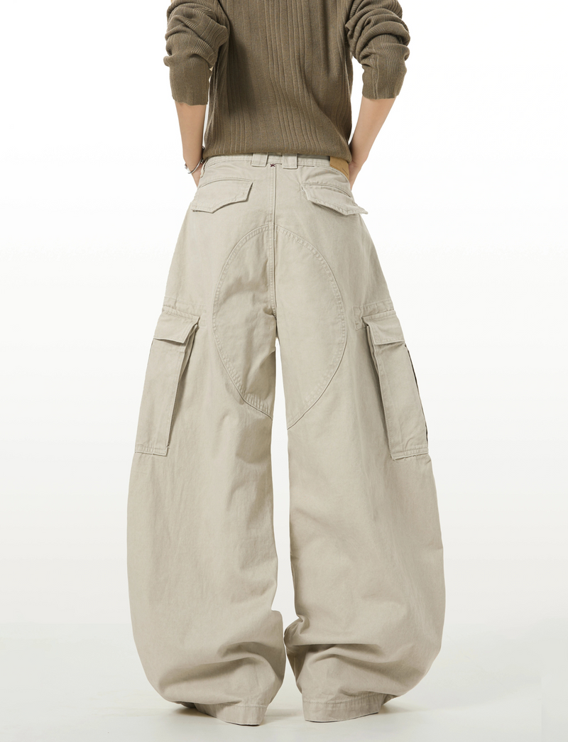 Model wearing beige wide-leg cargo pants with back cargo pockets, rear view
