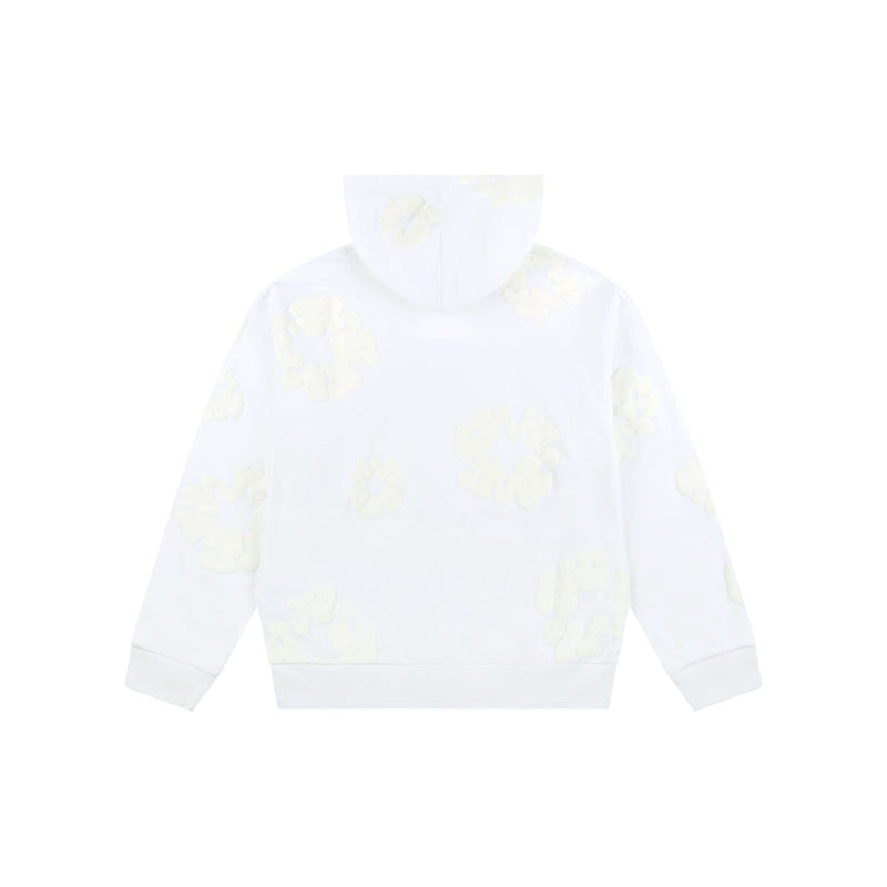 The White Monochrome “Cotton Wreath” Denim Tears Hoodie is shown from the back with faint light yellow cloud-like patterns, adding a subtle twist to minimal streetwear. The background is plain white.