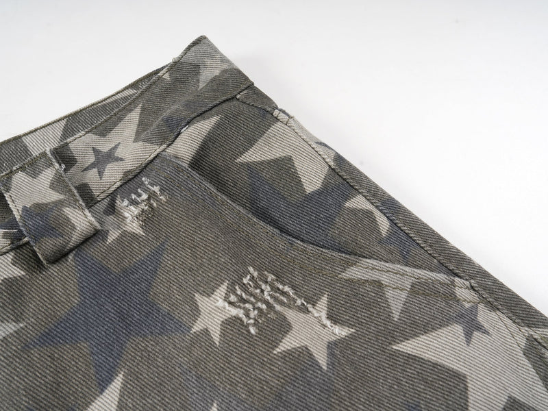 Close-up of back waistband corner and stitched star print denim