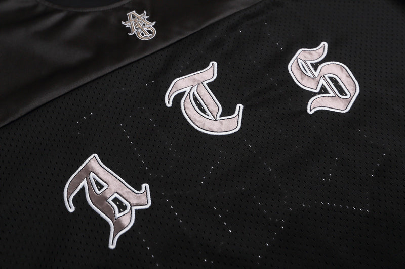 Black mesh football jersey T-shirt with gothic-style embroidered lettering and a small Seakoff logo on the chest