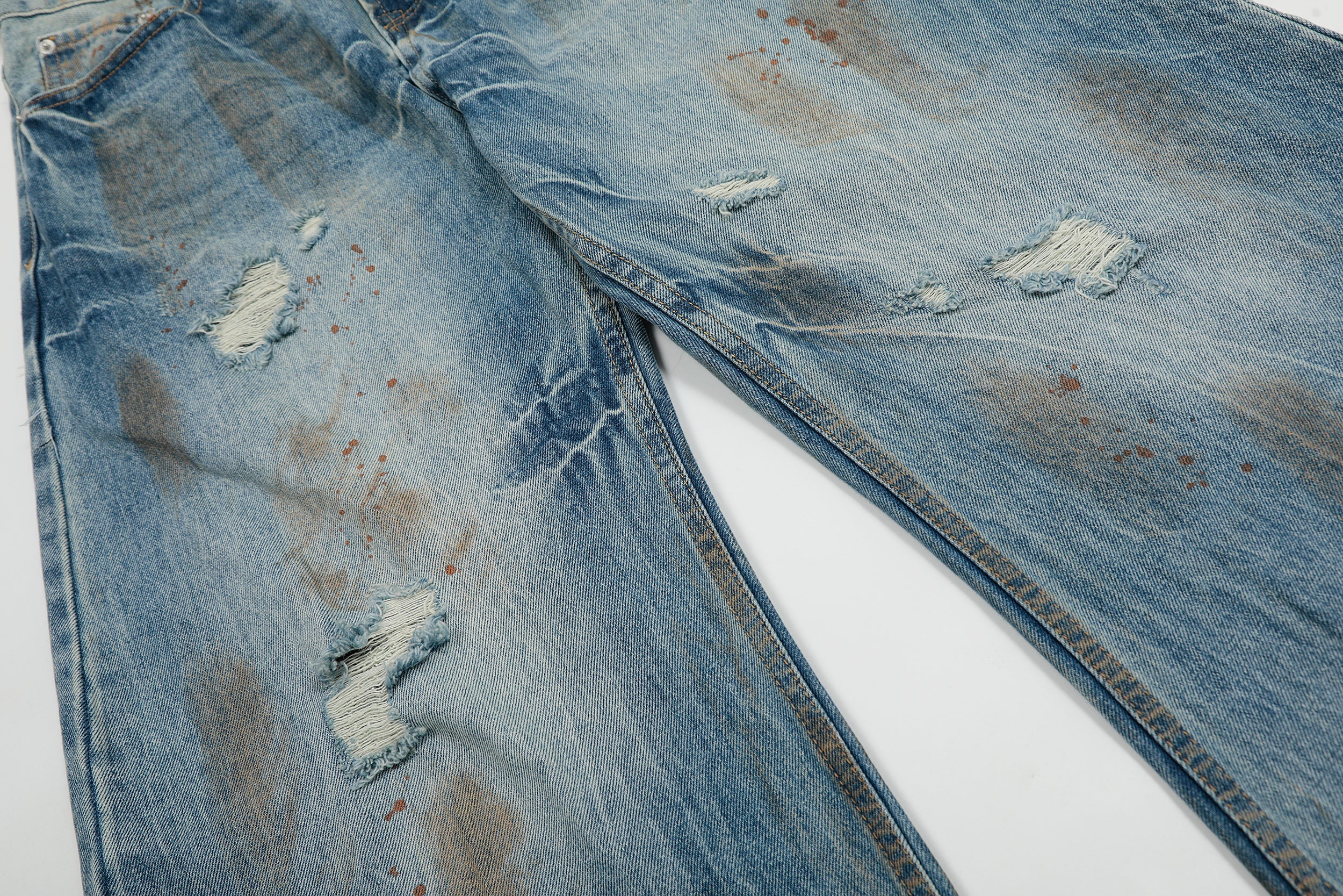 Rust-Wash Distressed Wide-Leg Jeans | Omirad
