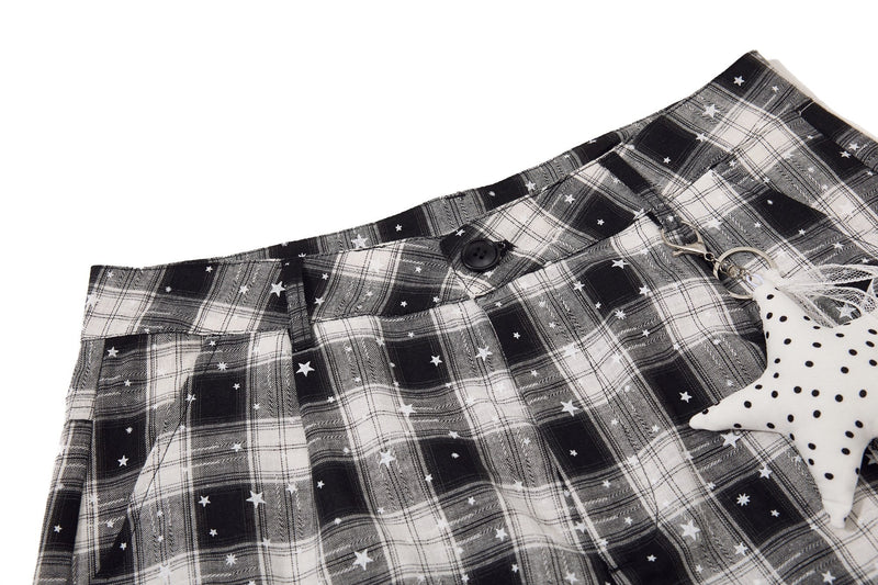 Waistband and front top of plaid cargo shorts with star charm detail