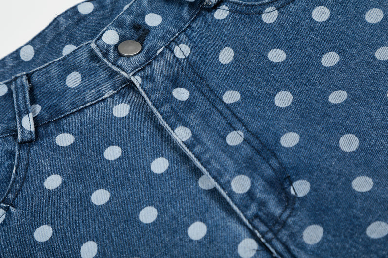 Close-up of waistband and front fly on blue washed polka dot denim