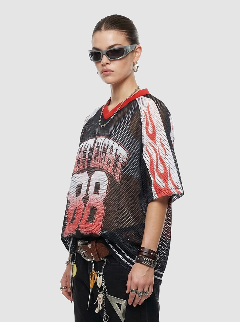 Model wearing a black mesh college jersey with red flame sleeves and number 88, styled with sunglasses and accessories
