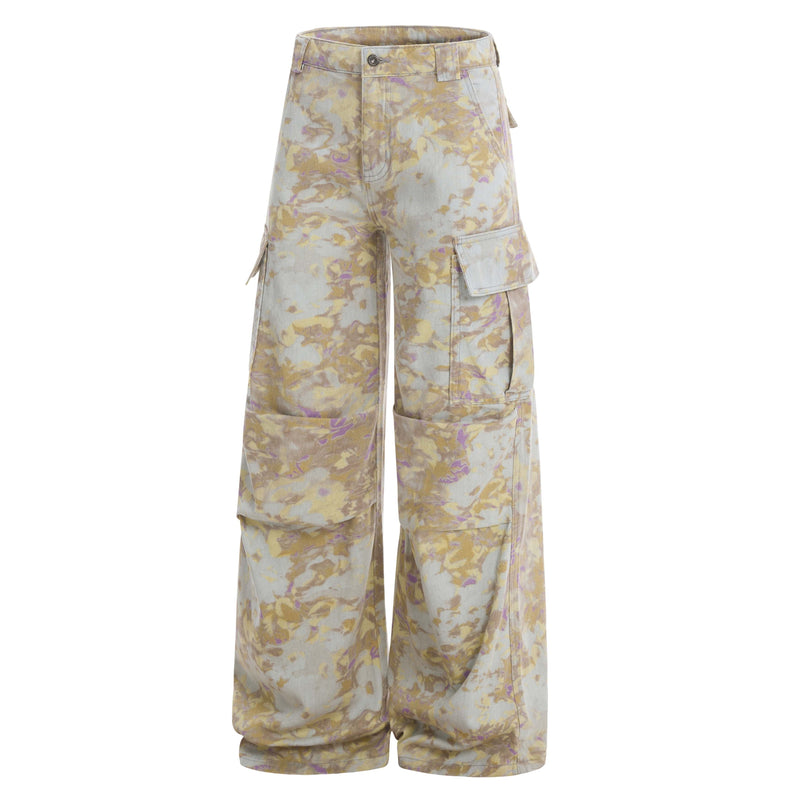 Front view of abstract camo cargo pants showing the right side pocket and wide legs