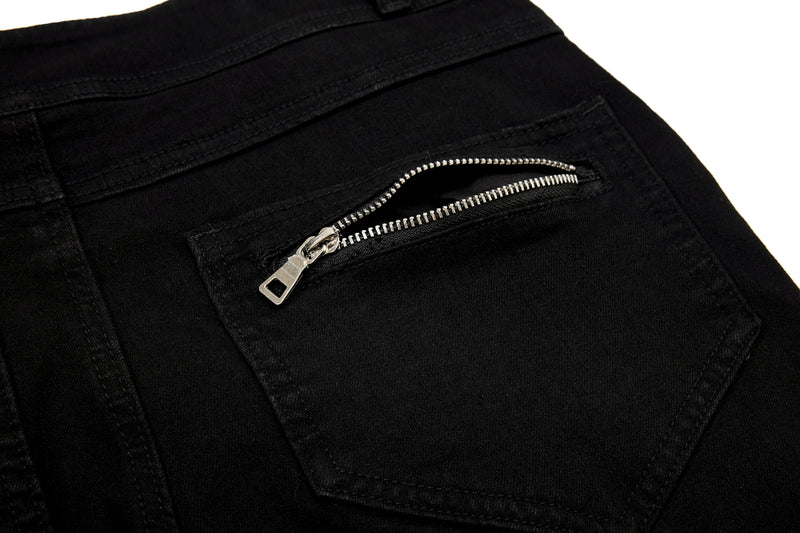 Close-up of back pocket zipper on black pants