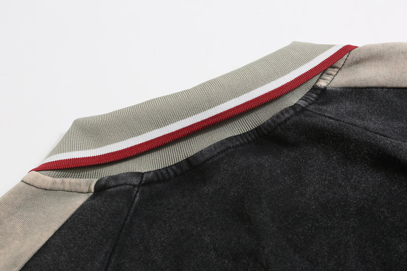 Striped ribbed collar and shoulder seam on black rugby sweatshirt with gray panel detail