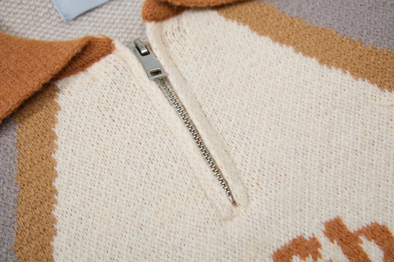 Close-up of half-zip front and cream knit texture on the retro colorblock sweater