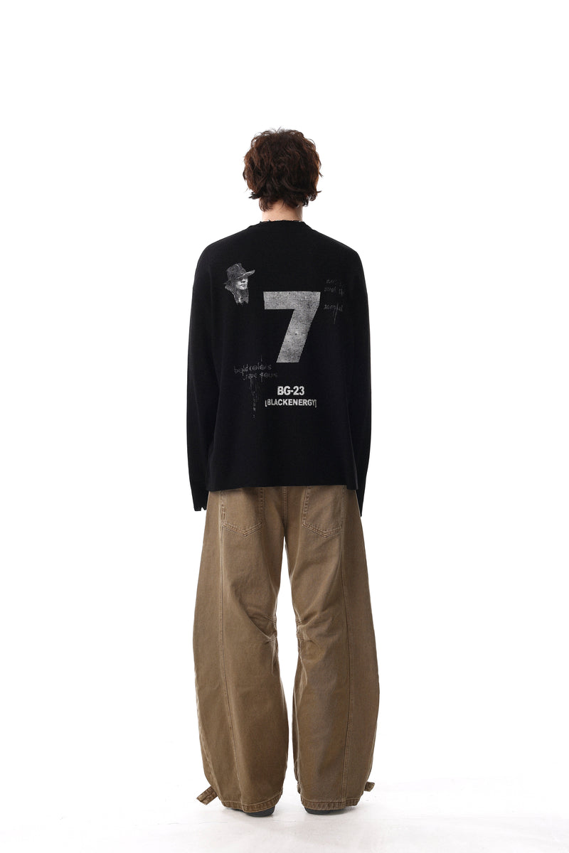 Black long sleeve tee back view on model with large 7 graphic and black energy text