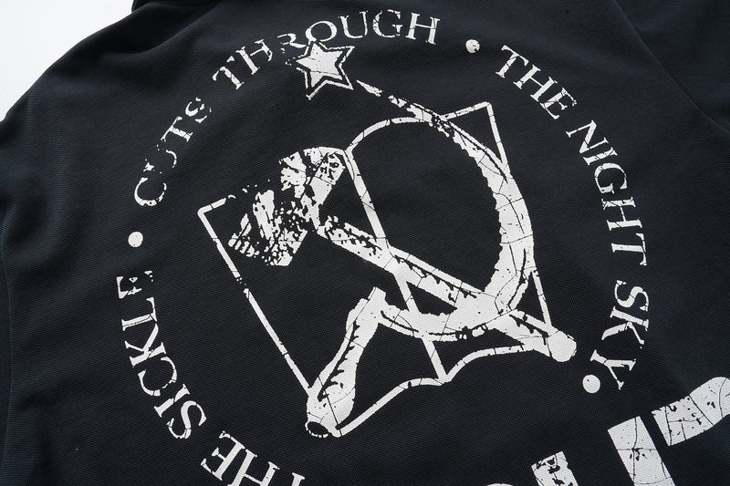 Black back graphic close-up with circular star design and distressed white lettering