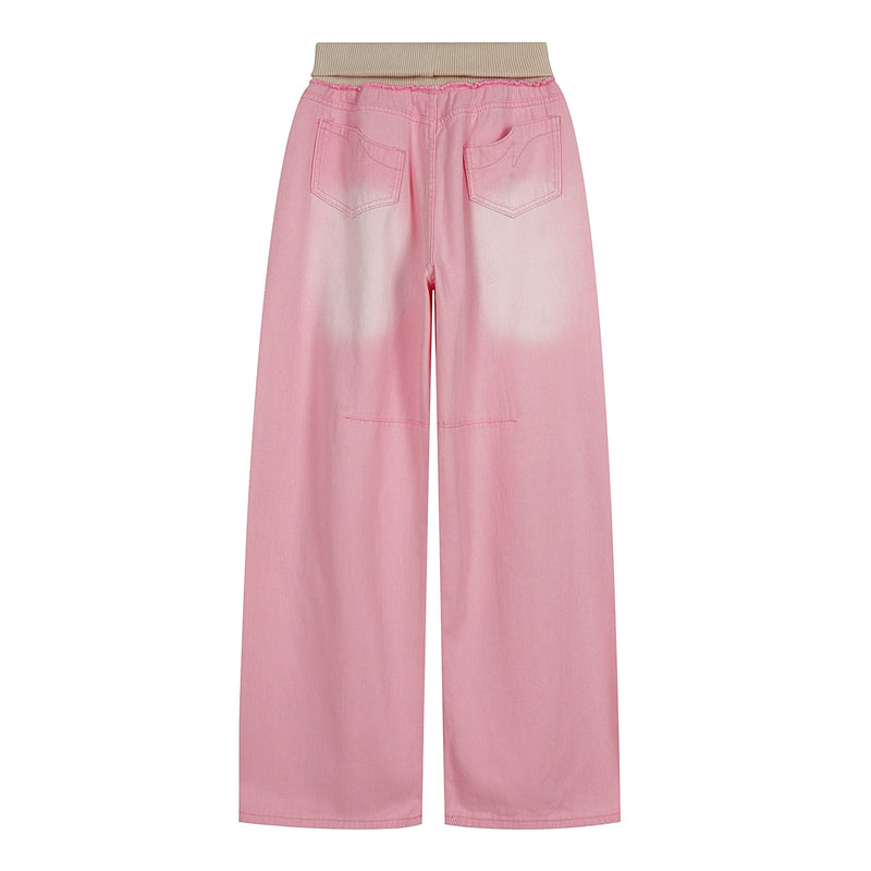 Back view of pink washed wide-leg jeans with beige ribbed waistband and rear patch pockets
