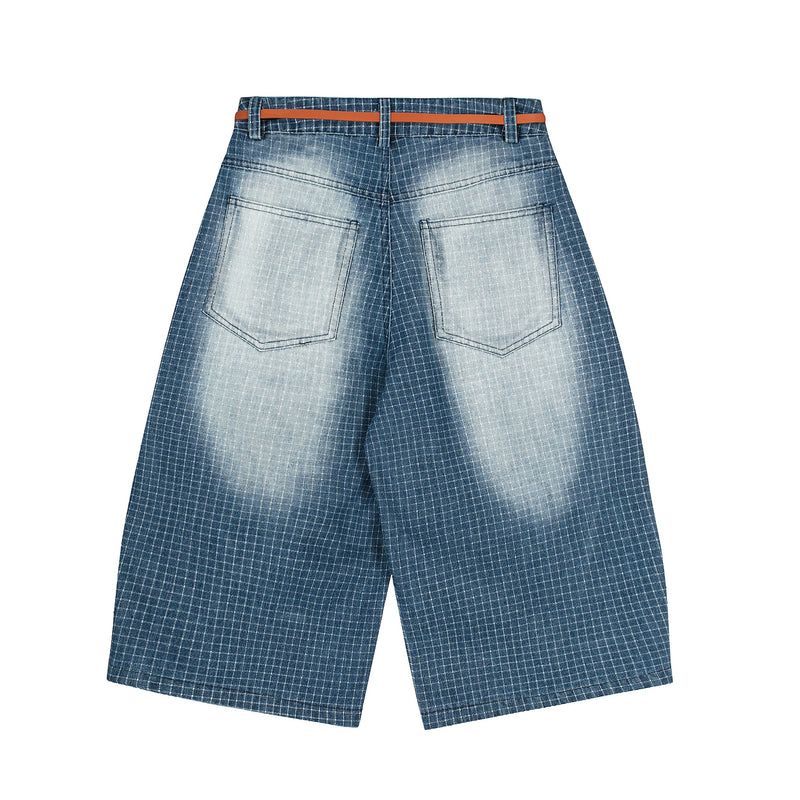 Back view of blue grid denim shorts with faded wash and orange belt
