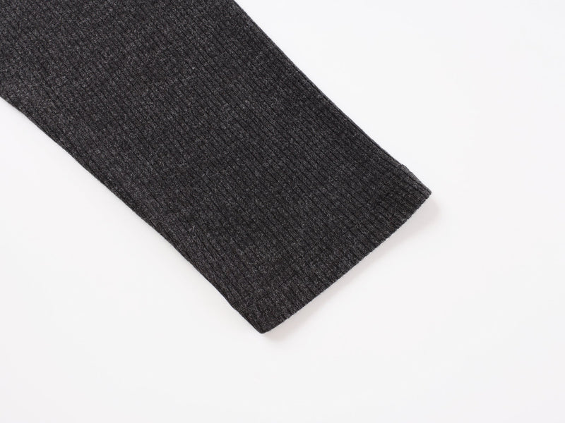 Close-up of black ribbed sleeve cuff