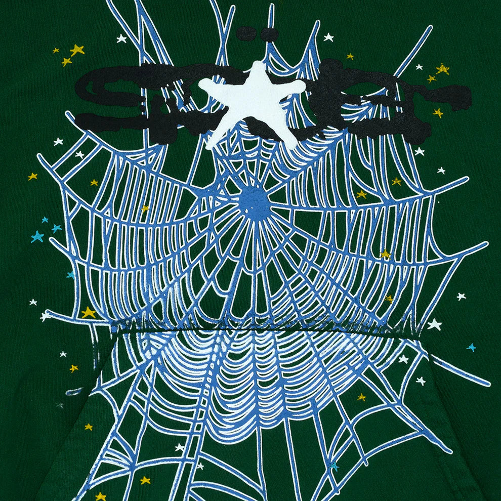 The Dark Green Graphic Hoodie with Spider Web Print features a white spider web and scattered stars, plus a white silhouette and bold black abstract text for standout street style. This comfort fit pullover is perfect for everyday wear.