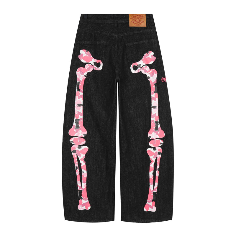 Black wide-leg denim pants with pink camouflage skeleton graphics on the front legs