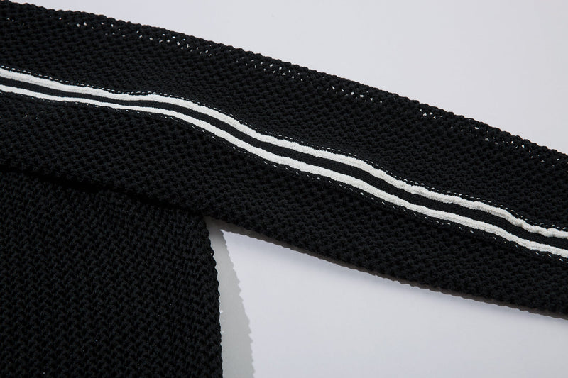 Black sleeve stripe detail on mesh knit track jacket close-up