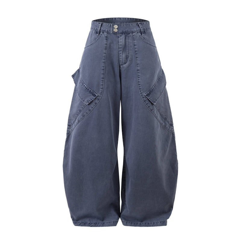 Front view of blue curved-cut barrel denim pants with wide legs and two-button waistband