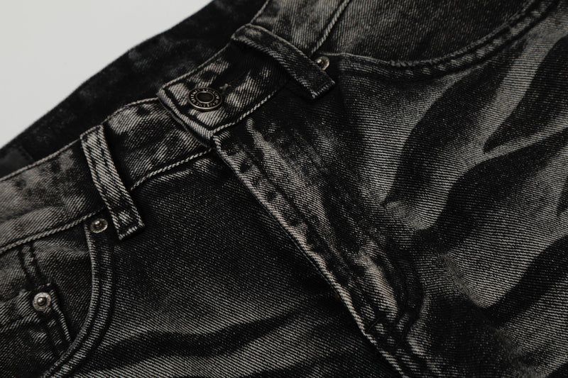Close-up of the jeans front waistband, button, belt loops, and pocket seam