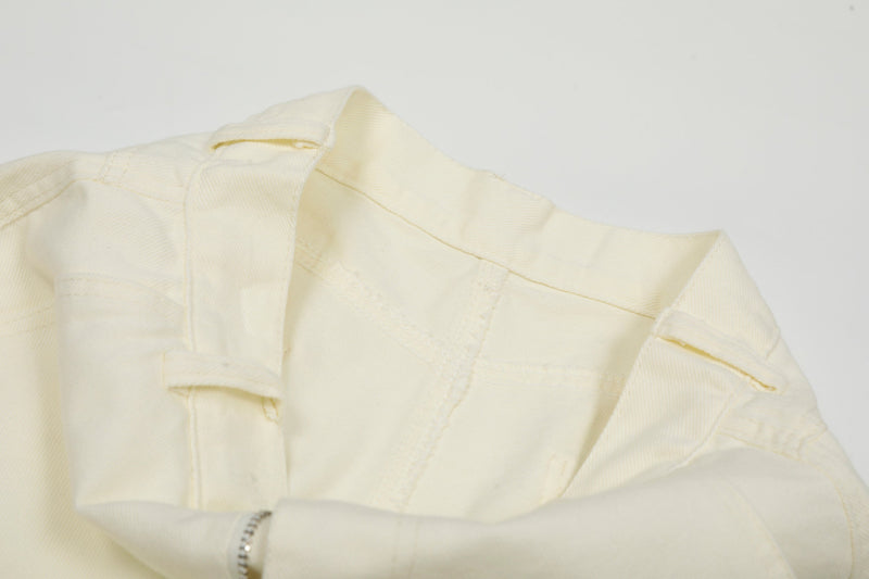 Close-up of cream cargo pants waistband and inner seam detail