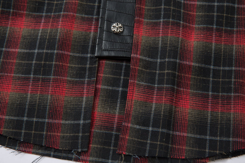 Lower front close-up of the plaid flannel shirt jacket with frayed hem edge