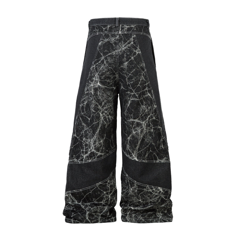 Black wide-leg jeans with cracked white pattern, back view