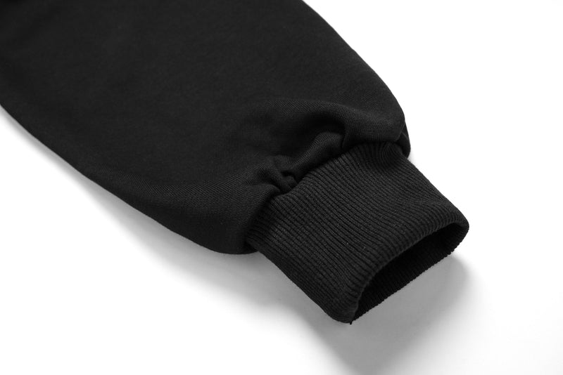 Close-up of black sleeve cuff with ribbed knit wristband