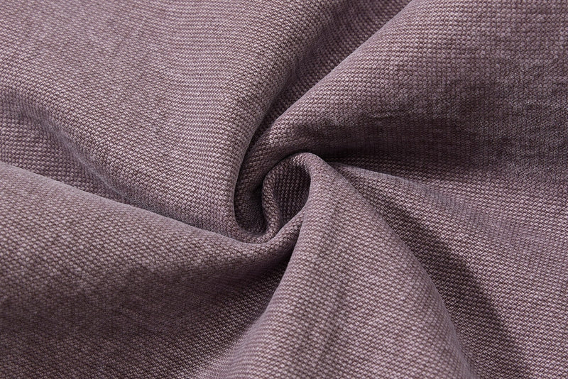 Close-up of brown denim fabric texture in soft folds