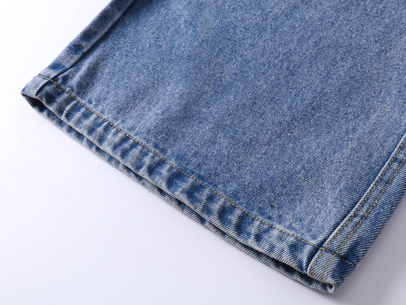 Close-up of blue jeans hem and stitched cuff