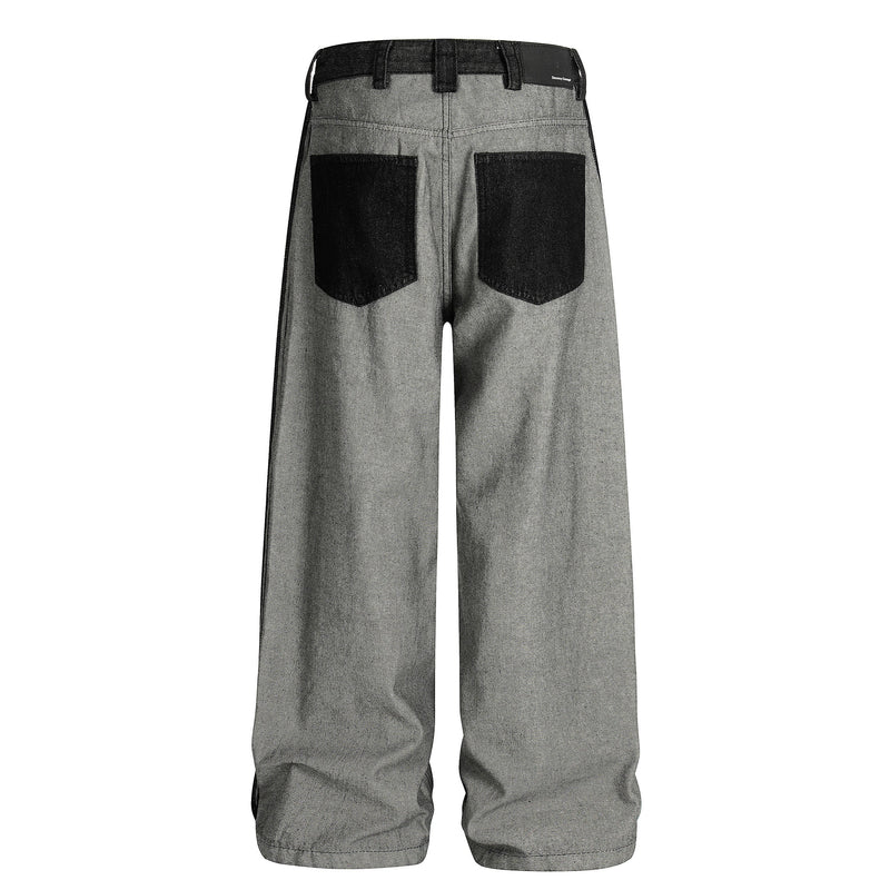 Back view of gray wide-leg jeans with black patch pockets and contrast waistband