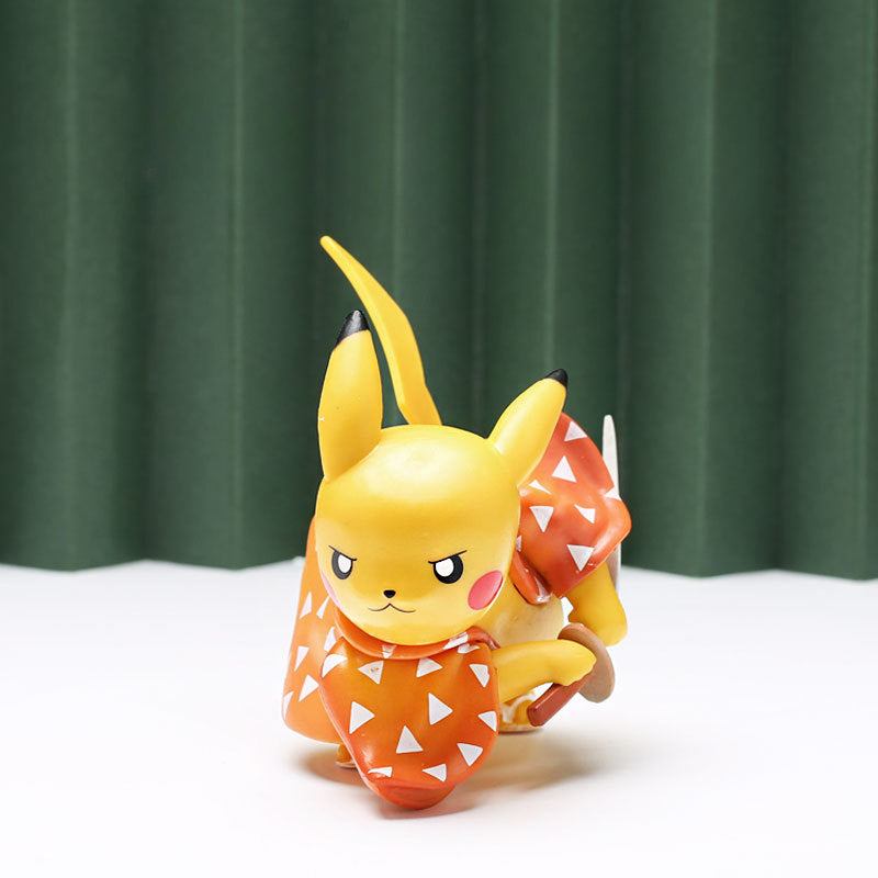 Part of the Demon Slayer 4-piece set, this 9cm Cosplay Pikachu action figure features a yellow, mouse-like creature in an orange kimono adorned with white triangles. It stands elegantly on a white surface against a green curtain backdrop.