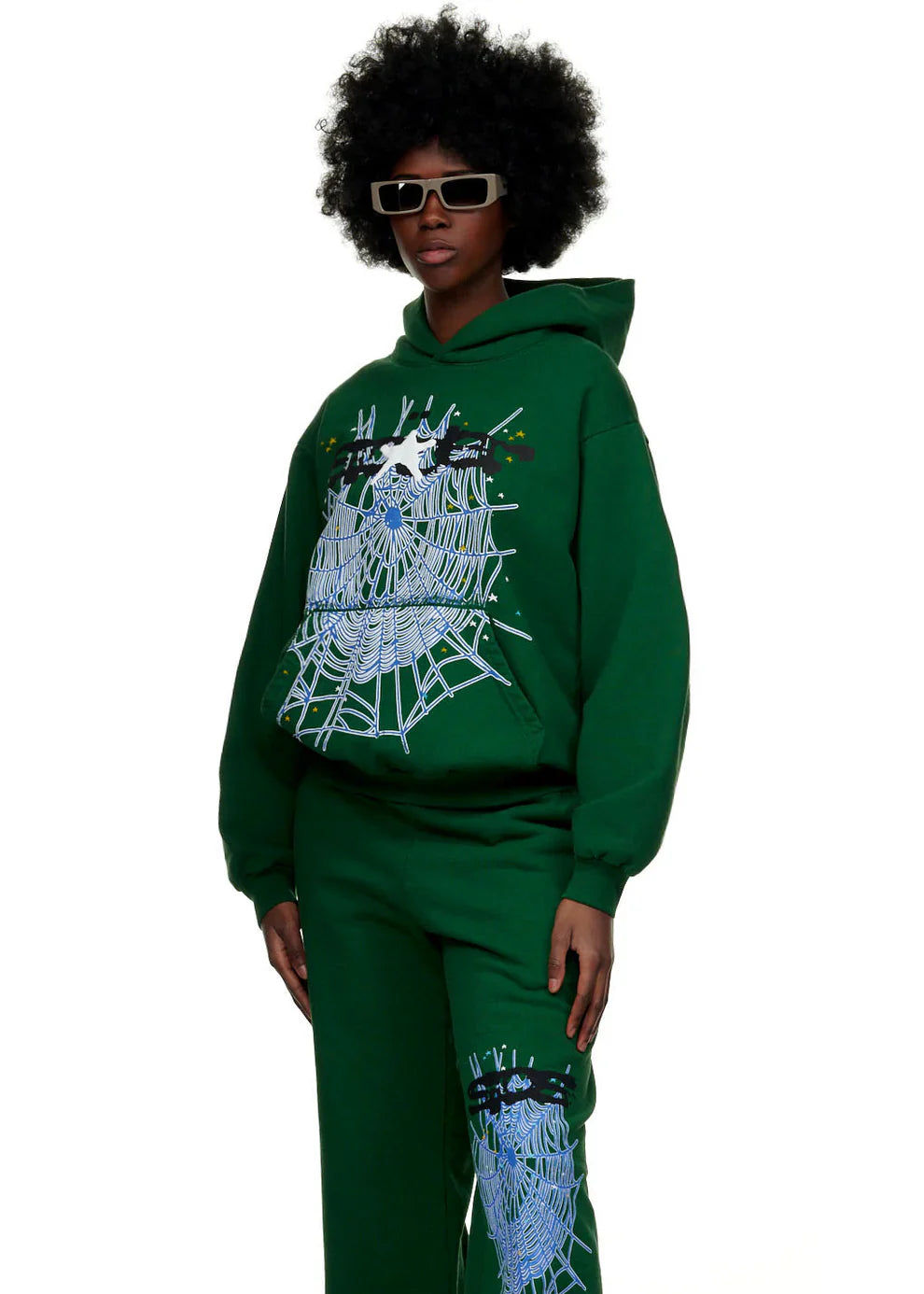 A person sports a natural afro and rectangular sunglasses, rocking the Dark Green Graphic Hoodie with Spider Web Print—an abstract, colorful comfort-fit pullover perfect for bold streetwear and everyday wear.