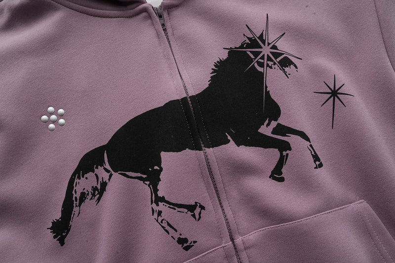 Close-up of lavender hoodie front with unicorn graphic and pocket details