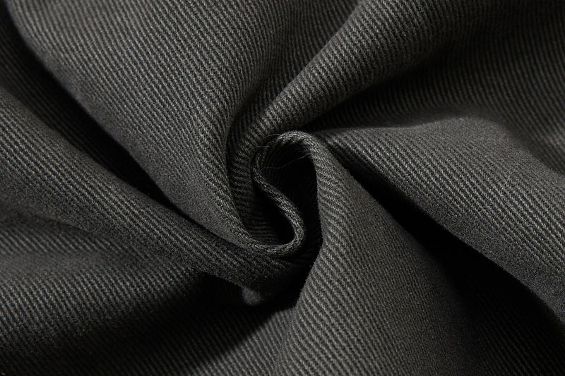 Close-up of black twill fabric folds and texture