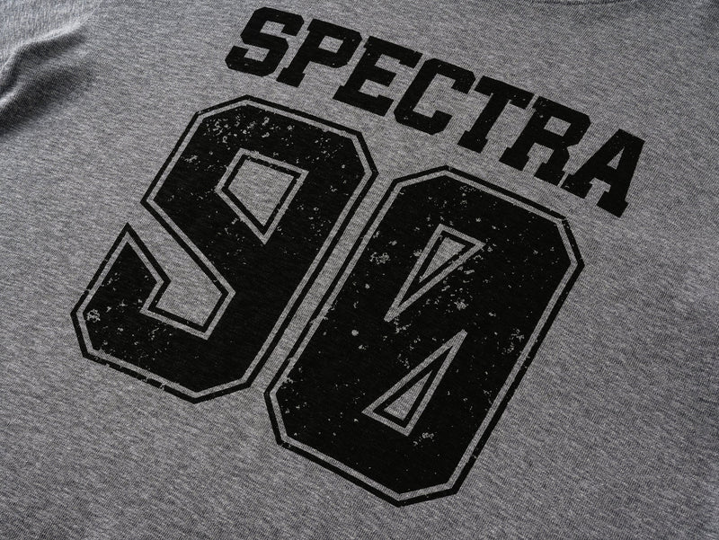 Close-up of gray tee front graphic with SPECTRA text and large 90 print
