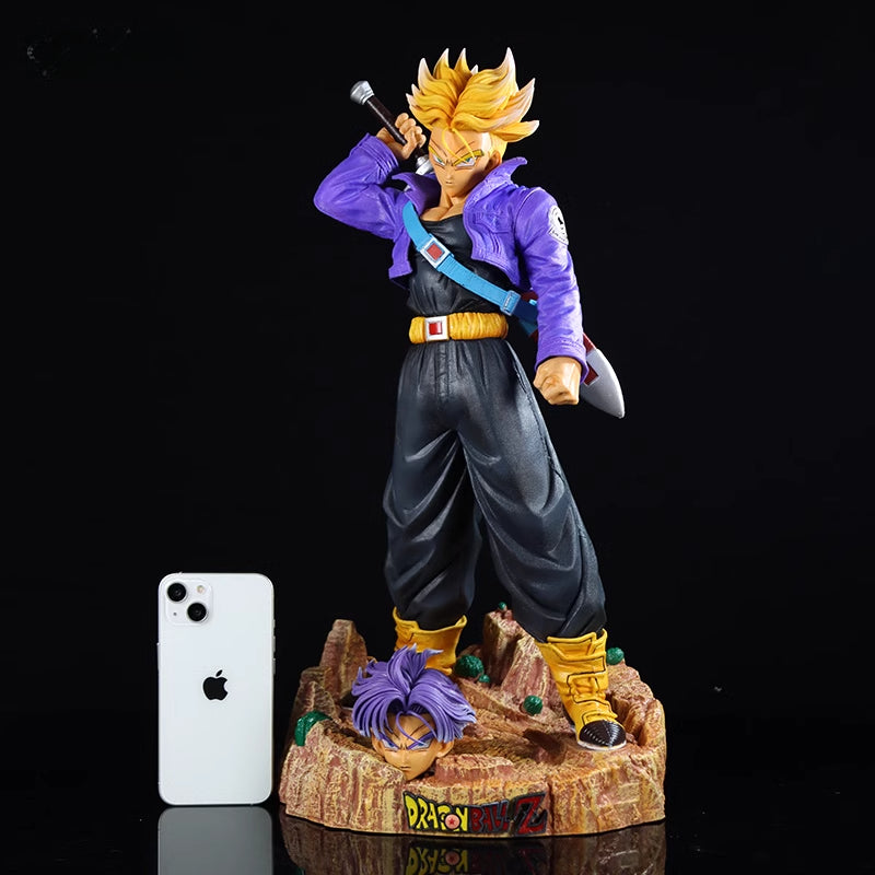 The Seakoff Trunks Collectible Figure from Dragon Ball Z, standing 50cm tall, features interchangeable heads and a sword pose. It comes with a purple jacket and rock-like base that intriguingly includes a severed head in the design.