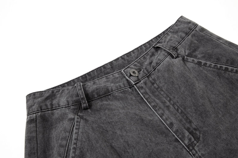 Close-up of waistband and front button on washed black cargo pants