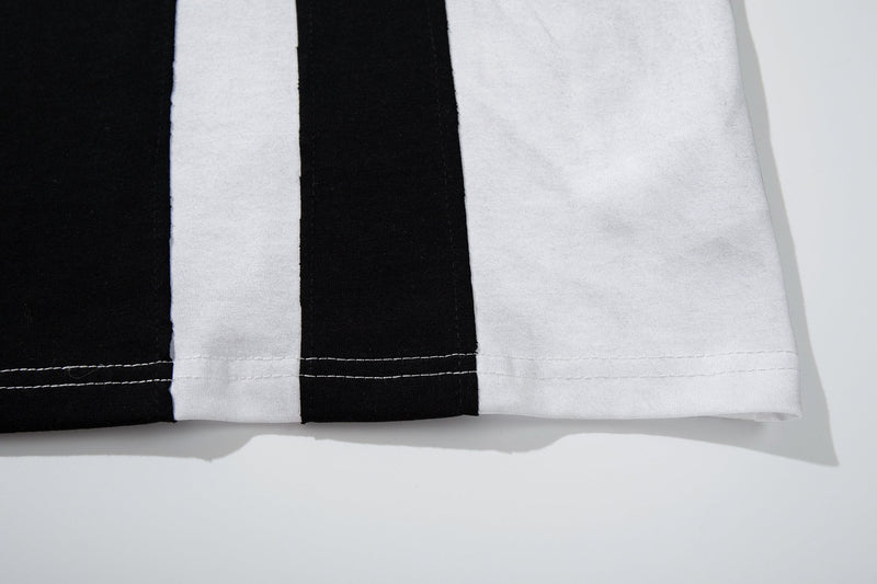 Black and white striped football jersey hem with visible stitching, featuring a clean streetwear-inspired tee design