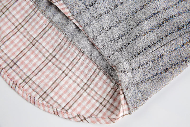 Corner close-up of pink plaid lining and gray sheer mesh overlay