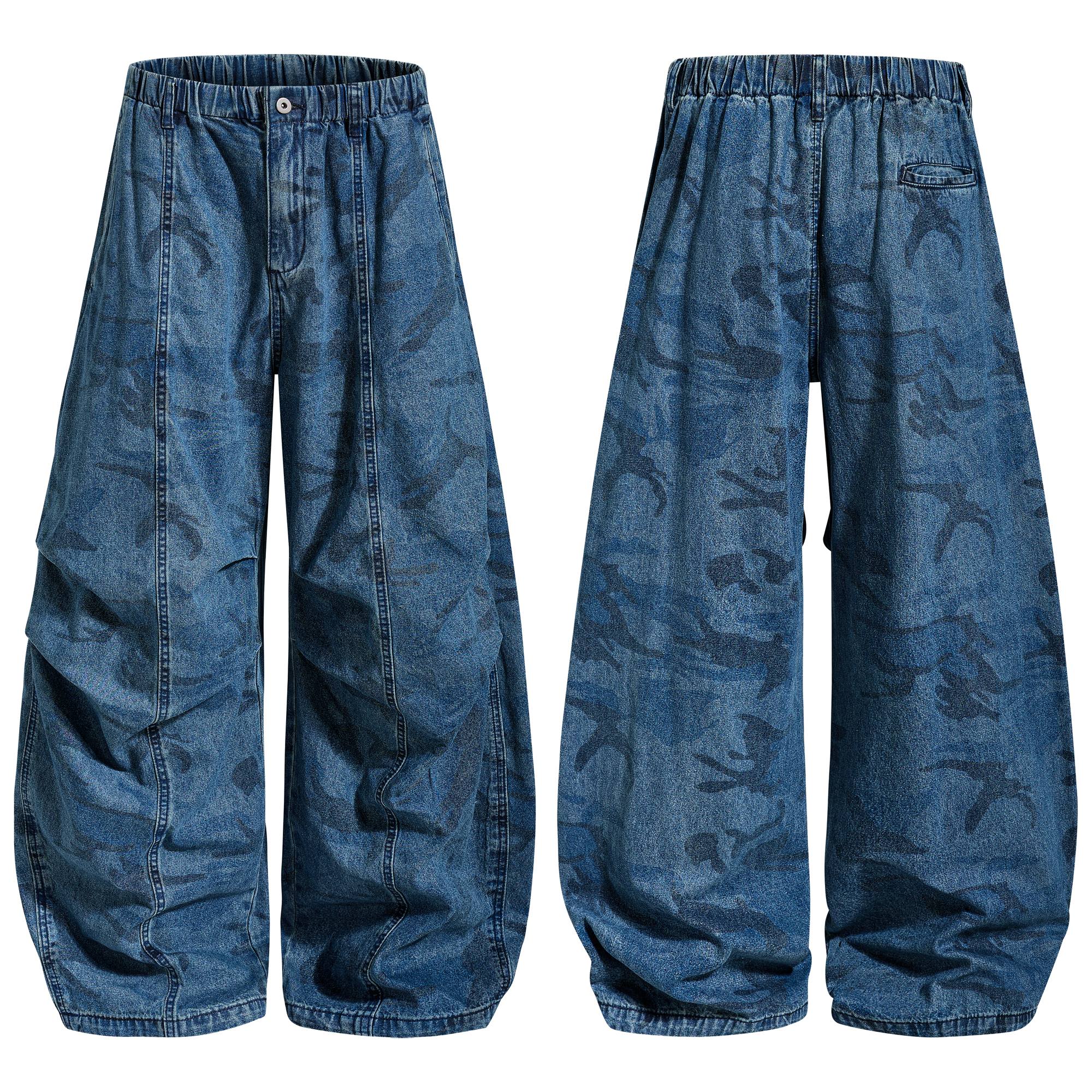 Front and back view of blue washed camo baggy jeans with elastic waistband and wide-leg silhouette