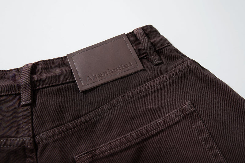 Close-up of brown leather waistband label on the back of the jeans