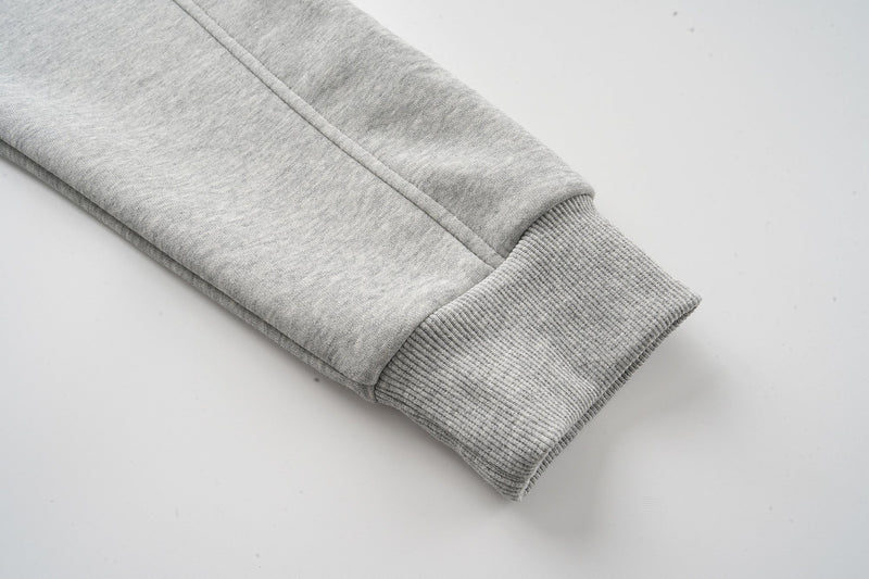 Heather grey hoodie sleeve cuff close-up showing ribbed knit texture