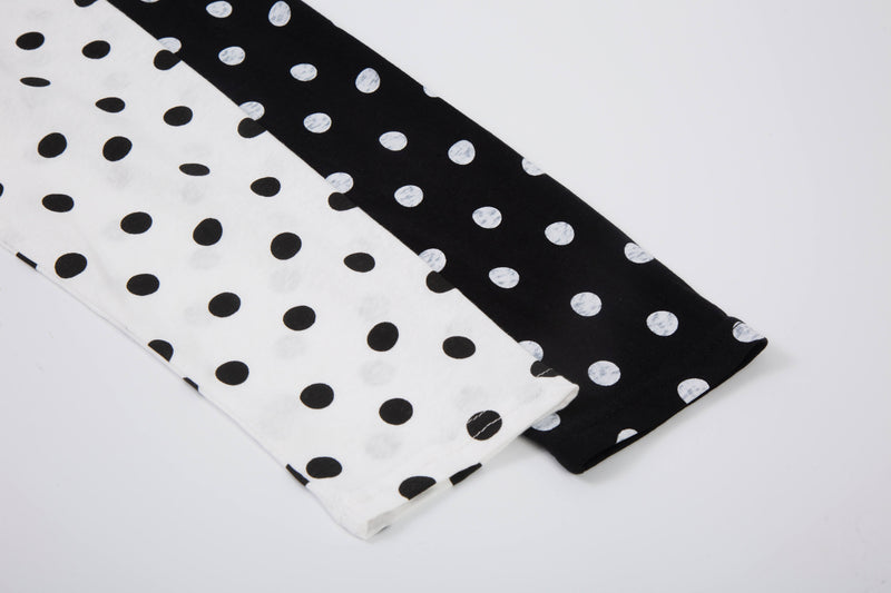 Folded black and white polka dot long sleeve tee sleeves with contrast raglan print