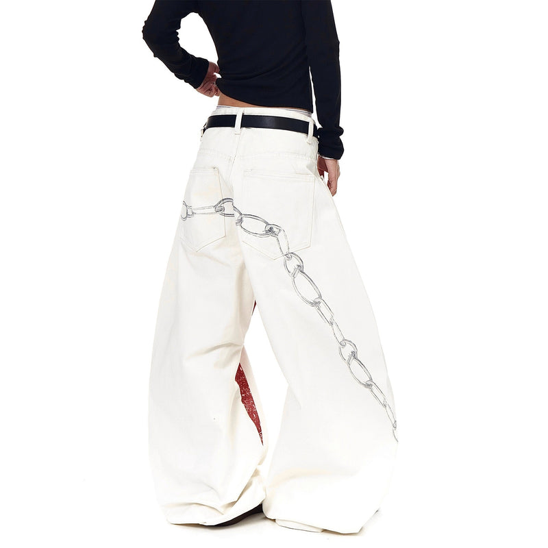 Back view of cream barrel jeans with chain graphic along the legs