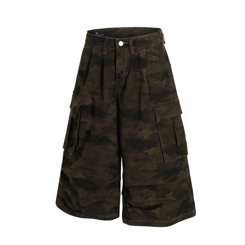 Front view of camo cargo shorts showing pleats, flap pockets, and wide legs