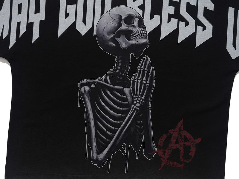 Black oversized gothic tee featuring a praying skeleton graphic with Blessed Bones lettering and red occult emblem