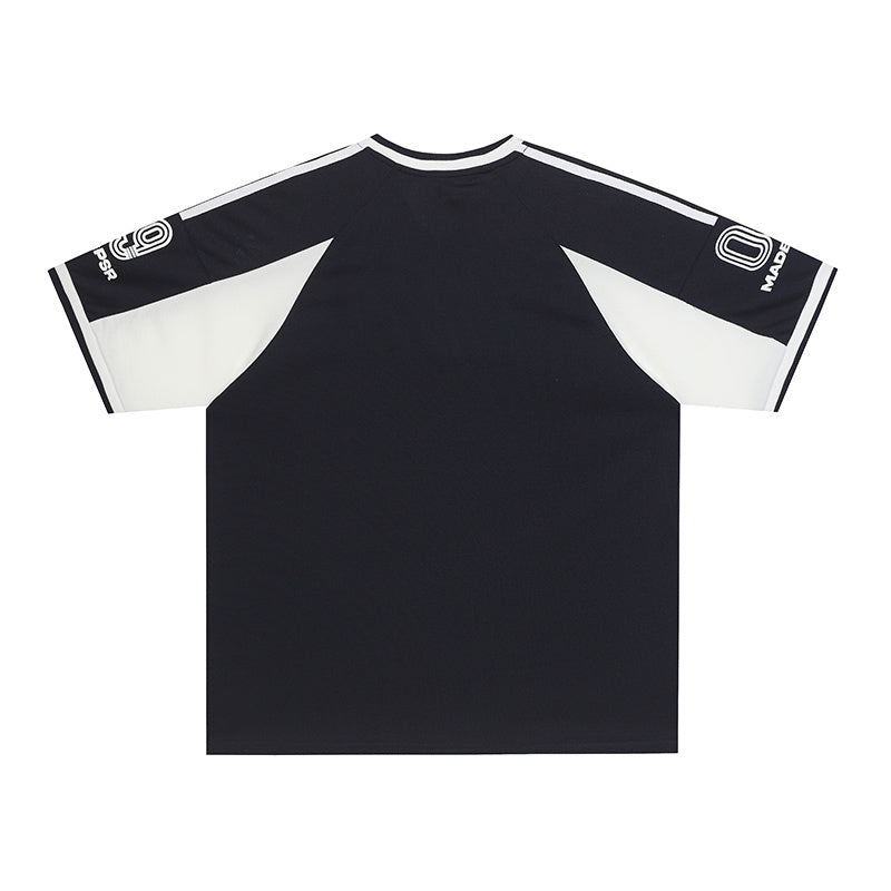 Black and white MADEGPSR 09 performance soccer jersey with short sleeves and bold shoulder stripe detailing