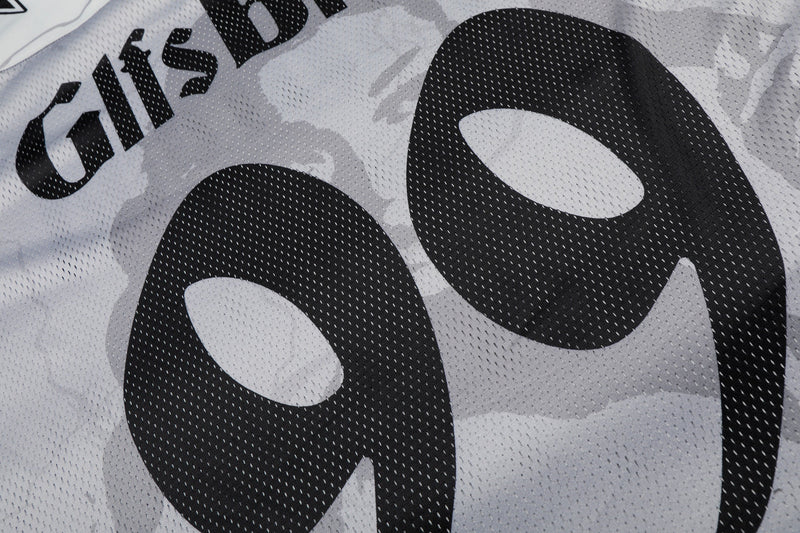 Close-up of a white mesh football jersey with bold black No. 99 graphic and GlfsBrand lettering