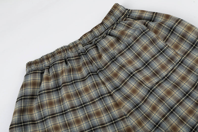 Close-up of elastic waistband on plaid lounge shorts