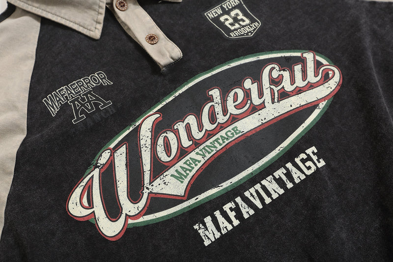 Close-up of front chest graphics on black distressed rugby polo sweatshirt